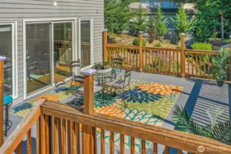 Another angle of the deck highlights its connection to the home’s main living areas through sliding glass doors, making indoor-outdoor entertaining effortless.