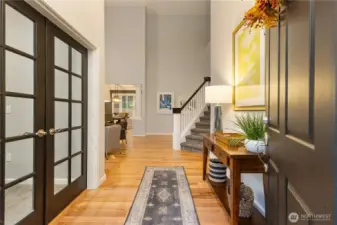 A very inviting foyer welcomes you featuring gleaming hardwood flooring. French doors open into a main-level office space - perfect for working at home!