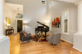 Another view from the living room towards the foyer. You will love the plantation shutters too!