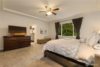 Another view of the Primary bedroom with a peek into the en suite bath...