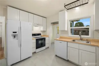 Updated cabinets and butcher block counters.
