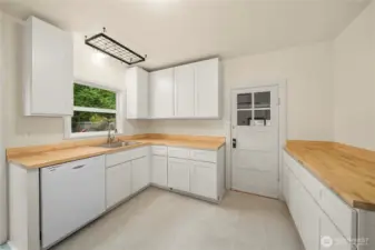 Updated cabinets and butcher block counters.