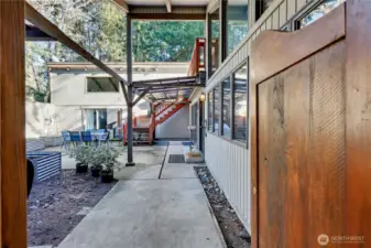 Both of the wooden doors form a gateway to the courtyard. This is lockable.