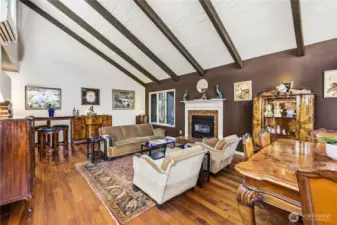 Large living room features a propane-fired fireplace for chilly nights and hardwood floors.