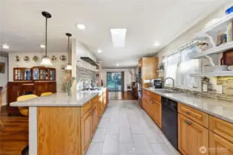Plenty of counter space for food prep and a large deep sink and spray faucet. This sunny spot brings in lots of light.