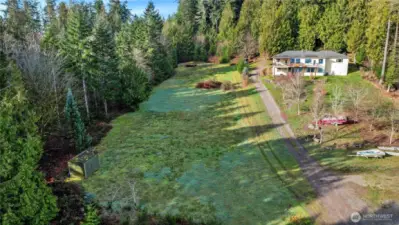 Lot gently slopes down to the see, perfect for daylight basement...