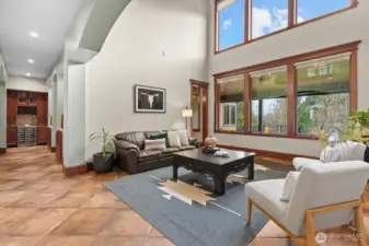 Sitting area with soaring ceilings that bring in natural light.