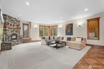 Living room with wood burning fireplace.