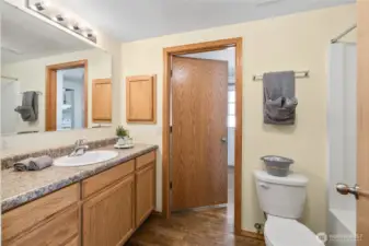 Lovely full hall guest bath with access from the hall or to the laundry room