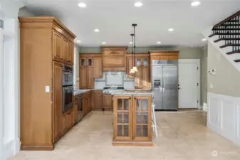 Island Kitchen; door to garage on far right; stairs on right; Pantry and bedroom out of frame