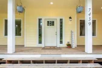 Step onto wraparound covered porch.