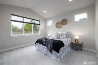 Main Floor Primary Suite with gorgeous easterly views of the Cultus Mountains