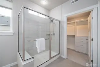 Primary ensuite bath with oversized walk-in tiled shower