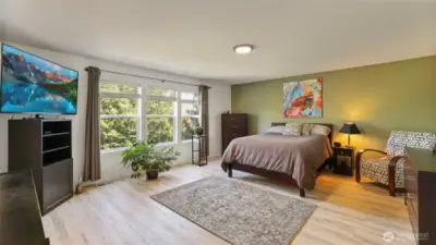 Bathed in natural light from oversized windows, the primary bedroom also provides space to add your personal touch — whether it’s a cozy reading nook, extra storage, or stylish décor