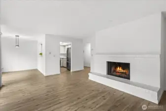 Spacious living area with a wood burning fireplace for those cozy winters.
