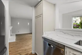 Large pantry cabinet for plenty of storage and  a convienient pass through to dining area.