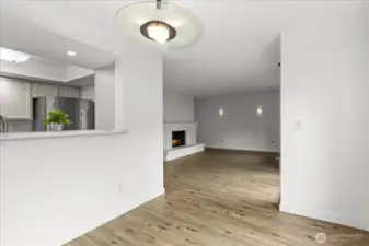Dining area has a convenient passthrough from kitchen and large window view of back patio.