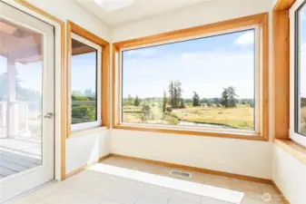 Sun room off primary suite with deck access