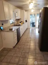 Ceramic tiled kitchen.