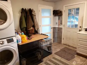 Huge laundry with two sets of washers/dryers included in sale.