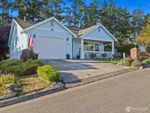 This home offers a large covered front porch, complete with dog-gate for enjoying those morning cups of coffee