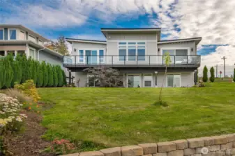 Modern design with Metal roof, Hardie siding, end to end composite decking, daylight basement, air conditioning and private beach access