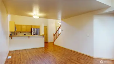 Looking back at the dining area, breakfast bar and kitchen area.