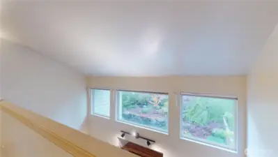 Looking from the loft area at the transom windows in the Livingroom area