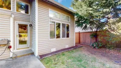 Looking in the back yare and at the entertainment patio area.