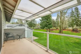 Private covered porch off the primary bedroom- perfect for QUIET moments overlooking the backyard.