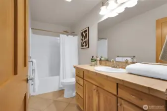 Upper-level bathroom with TONS of counter space.