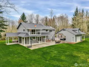 Back patio overlooking peaceful acreage.Detached workshop with storage loft above.