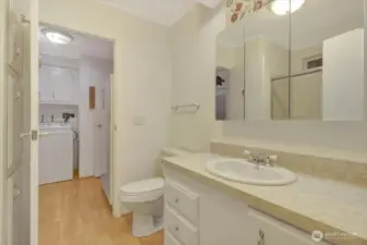 Guest bathroom allows pass through access from 2nd b/r to laundry room