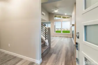 Main level entry opens to bedroom #3, laundry,3rd bath, living/kitchen