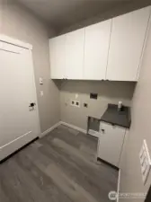 Laundry room with counter & cabinets