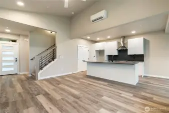 Spacious living/kitchen combo looking back at main entry