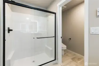 Ensuite with large walk-in shower + private lav area to right