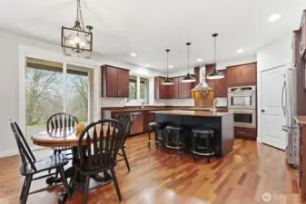 Kitchen breakfast nook, with sliding glass door to back patio.
