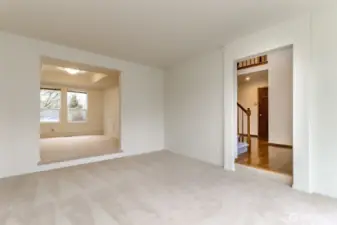 Living room is off the entry way and opens to the formal dining room
