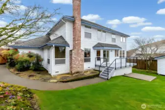 Fully fenced backyard with mature landscaping