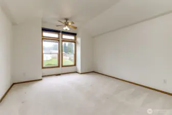 Upstairs primary bedroom with vaulted ceilings and dedicated mini split for comfort.
