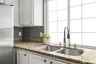 Sink with view out window to front of house