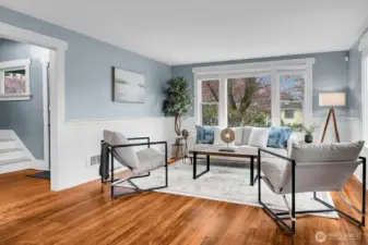 Original wood floors and bright white wainscoting are a showstopper!