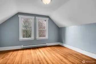 The first bedroom upstairs with coved ceiling and those gorgeous wood floors!