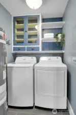 Main floor utility room with built-in storage. Washer & Dryer stay!