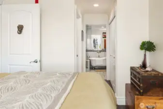 Primary suite includes two spacious closets, full bath, and balcony.
