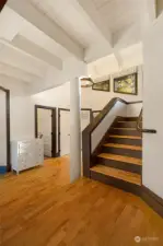 Main home stairs leading to 2 upstairs ensuite bedrooms.