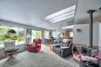 Woodstove in living room to keep you cozy during the cooler months.