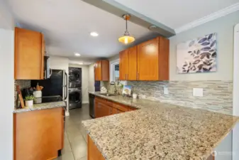 Updated granite, tile backsplash, and tile floor