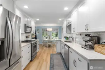 Bright, galley kitchen with dining space